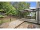 Wooden back deck with a gazebo and a brick patio with a fire pit at 325 Meadows Ln, Canton, GA 30114