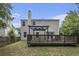 Spacious backyard with a deck, pergola, and lush green lawn perfect for outdoor living at 325 Meadows Ln, Canton, GA 30114