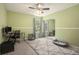 Functional bedroom with desk, comfortable chair, and stylish rug with view of sliding closet doors at 325 Meadows Ln, Canton, GA 30114
