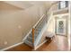 Inviting entryway with wood floors, stairs to the second floor, and a decorative front door at 325 Meadows Ln, Canton, GA 30114