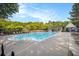 Community swimming pool with lounge chairs and landscaping at 325 Meadows Ln, Canton, GA 30114