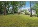 Lush backyard featuring mature trees and serene landscape at 5631 Queensborough Dr, Atlanta, GA 30338