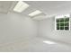 Carpeted basement bedroom with white walls and a window that lets in natural light at 5631 Queensborough Dr, Atlanta, GA 30338