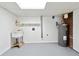 Utility area in the basement features a sink and water heater at 5631 Queensborough Dr, Atlanta, GA 30338