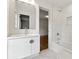 A modern bathroom vanity with updated tiling and fixtures at 5631 Queensborough Dr, Atlanta, GA 30338