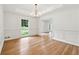Dining room with hardwood floors, wainscoting and a coffered ceiling at 5631 Queensborough Dr, Atlanta, GA 30338