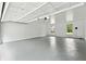 Bright and clean garage with white walls, painted floor, and windows at 5631 Queensborough Dr, Atlanta, GA 30338