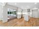 Bright kitchen features an island and access to an outdoor sunroom at 5631 Queensborough Dr, Atlanta, GA 30338