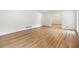 Bright living room with wood floors leading to a dining area at 5631 Queensborough Dr, Atlanta, GA 30338