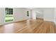 Large room features hardwood flooring, lots of natural light and access to other rooms at 5631 Queensborough Dr, Atlanta, GA 30338