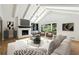 Inviting living room features vaulted ceiling and a cozy fireplace at 5631 Queensborough Dr, Atlanta, GA 30338