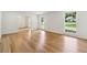 This spacious living room features hardwood floors and many windows at 5631 Queensborough Dr, Atlanta, GA 30338