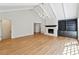 Bright living room features a fireplace and a built-in bookcase at 5631 Queensborough Dr, Atlanta, GA 30338