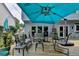 Inviting backyard patio with outdoor seating, perfect for entertaining and relaxation at 785 Cirrus Dr, Johns Creek, GA 30022