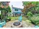 Spacious backyard with patio, fire pit, and mature landscaping, perfect for outdoor living at 785 Cirrus Dr, Johns Creek, GA 30022
