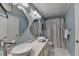 Bathroom featuring a marble countertop with double bowl sinks and stylish lighting at 785 Cirrus Dr, Johns Creek, GA 30022