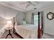 Cozy bedroom features a four-poster bed, soft lighting, and an ornate mirror at 785 Cirrus Dr, Johns Creek, GA 30022