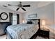 Well-lit bedroom with a large bed, dark furniture, and tasteful decor at 785 Cirrus Dr, Johns Creek, GA 30022