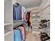 Walk-in closet with built in shelves and hanging rods at 785 Cirrus Dr, Johns Creek, GA 30022