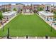 Expansive community green space featuring pavilions, dining areas, and a central fountain, surrounded by residential buildings at 785 Cirrus Dr, Johns Creek, GA 30022