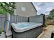 Private backyard hot tub with wooden deck and privacy fence at 785 Cirrus Dr, Johns Creek, GA 30022