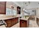 Eat-in kitchen with granite countertops, island, stainless steel appliances, and barstool seating at 785 Cirrus Dr, Johns Creek, GA 30022