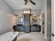 Elegant main bathroom with dual sinks, stylish mirrors, cabinets, soaking tub, and walk-in shower at 785 Cirrus Dr, Johns Creek, GA 30022
