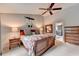 Spacious main bedroom with a ceiling fan, large windows, and en-suite bathroom at 785 Cirrus Dr, Johns Creek, GA 30022