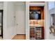 Charming wine bar featuring dark cabinets, wooden accents and a wine cooler for elegant in-home entertaining at 785 Cirrus Dr, Johns Creek, GA 30022