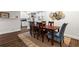Charming dining room offers a wooden table, comfortable seating, and views into the kitchen area at 802 Frederica Ne St # 5, Atlanta, GA 30306