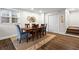 Bright dining room showcases a wooden table, comfortable seating, and adjacent staircase at 802 Frederica Ne St # 5, Atlanta, GA 30306