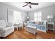 Bright bedroom with hardwood floors, white furnishings, and a cozy daybed at 956 Clifton Ne Rd, Atlanta, GA 30307
