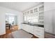Bright kitchen with white cabinets, black countertops, and a view into the dining area at 956 Clifton Ne Rd, Atlanta, GA 30307