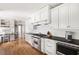 Modern kitchen with stainless steel appliances, dark countertops, and custom cabinetry at 956 Clifton Ne Rd, Atlanta, GA 30307