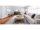 Comfortable living room area with large sectional couch, accent rug, hardwood floors, and elegant decor at 956 Clifton Ne Rd, Atlanta, GA 30307
