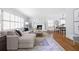 Inviting living space with fireplace, hardwood floors, a sectional sofa, and bright natural light at 956 Clifton Ne Rd, Atlanta, GA 30307