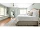 Calming main bedroom featuring soft colors, hardwood floors, built-in shelves and a window seat at 956 Clifton Ne Rd, Atlanta, GA 30307