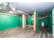 Unfinished basement with exposed ductwork, painted walls, and laminate flooring provides potential for customization and added living space at 1916 Highway 138 Sw, Conyers, GA 30094