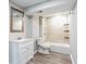 This updated bathroom features a modern vanity, neutral tile, and a tub/shower combination for a clean and fresh feel at 1916 Highway 138 Sw, Conyers, GA 30094