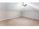 Spacious bedroom with vaulted ceiling, ceiling fan, and neutral carpeting at 1916 Highway 138 Sw, Conyers, GA 30094