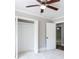Bedroom featuring a ceiling fan, closet, and neutral carpeting at 1916 Highway 138 Sw, Conyers, GA 30094