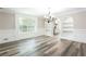 Bright dining room with hardwood floors, and decorative lighting at 1916 Highway 138 Sw, Conyers, GA 30094