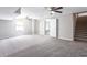 Large, carpeted living area in the finished basement at 1916 Highway 138 Sw, Conyers, GA 30094