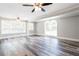 Spacious living room features hardwood floors, large windows, and recessed lighting at 1916 Highway 138 Sw, Conyers, GA 30094
