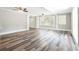 Open-concept living room featuring hardwood floors and white trim at 1916 Highway 138 Sw, Conyers, GA 30094