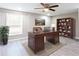 This home office includes an executive desk, bookshelf, and large window, creating an ideal work-from-home setting at 1916 Highway 138 Sw, Conyers, GA 30094
