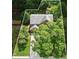 Aerial view of house and surrounding lot, which is full of lush green trees at 3570 Bardfield Ct, Cumming, GA 30041