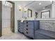 Charming bathroom features dual sinks with vintage-style vanity and ample lighting at 3570 Bardfield Ct, Cumming, GA 30041