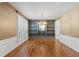 Elegant dining room featuring hardwood floors, wainscoting, and a chandelier above a table at 3570 Bardfield Ct, Cumming, GA 30041