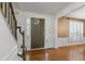 Inviting entryway featuring hardwood floors, stylish doors, and a staircase with a beautiful railing at 3570 Bardfield Ct, Cumming, GA 30041